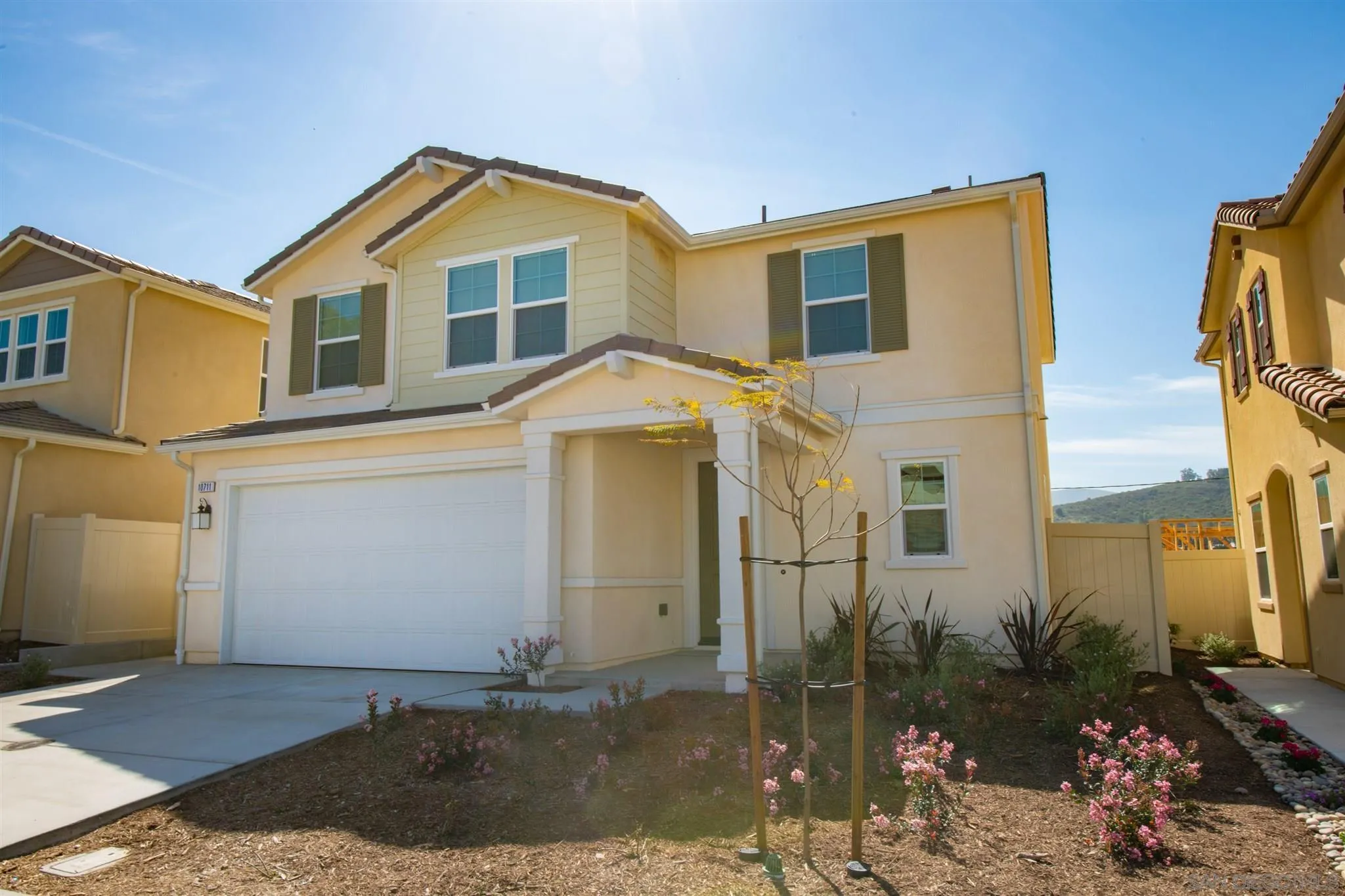 10711 Porter Terrace Spring Valley, CA 91978 - Photo 2 of 17 a front view of a house with a yard