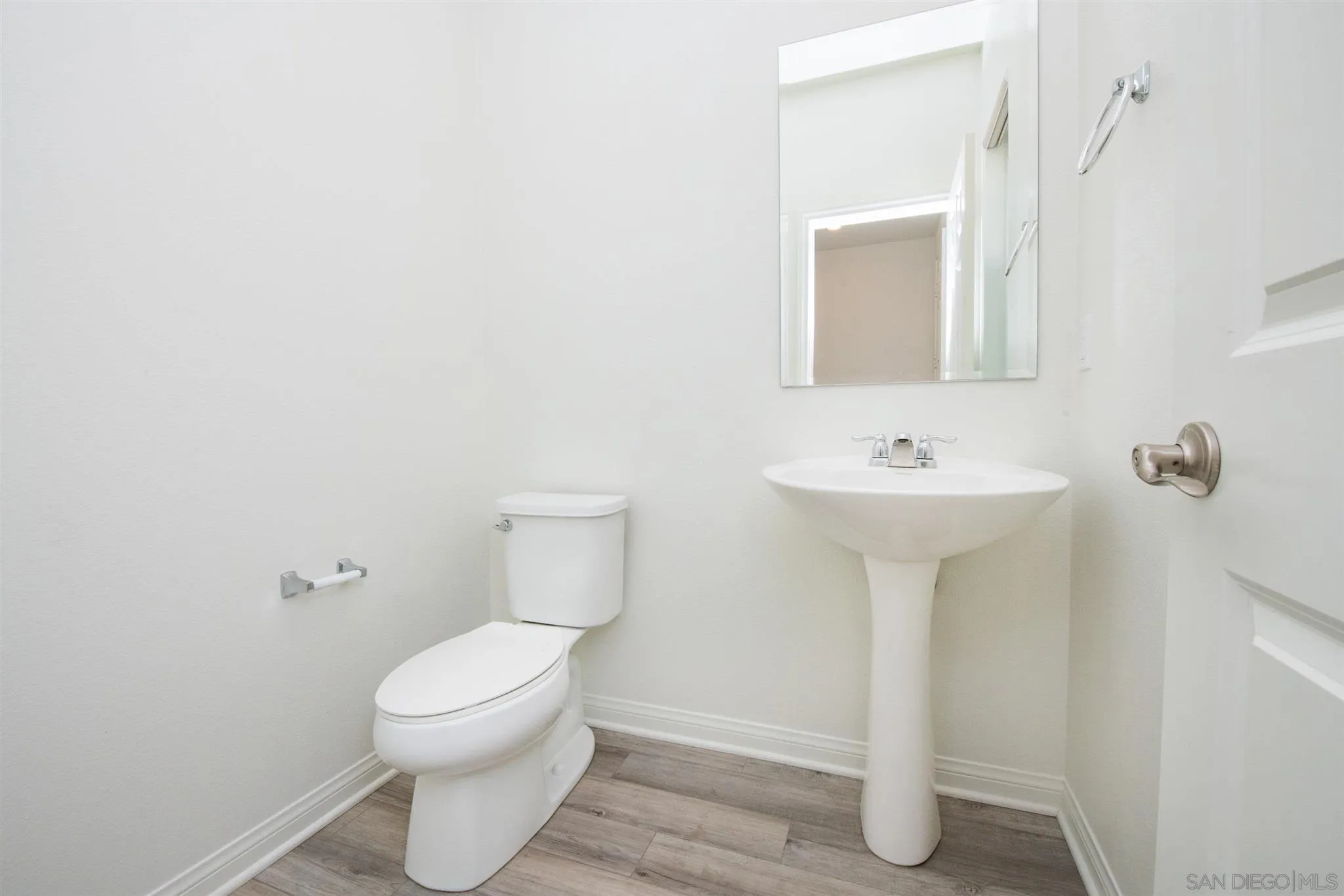10711 Porter Terrace Spring Valley, CA 91978 - Photo 10 of 17 a bathroom with a sink toilet and mirror