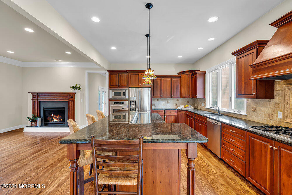 103 Obre Road Colts Neck, NJ 07722 - Photo 14 of 64 12_Kitchen_Fireplace