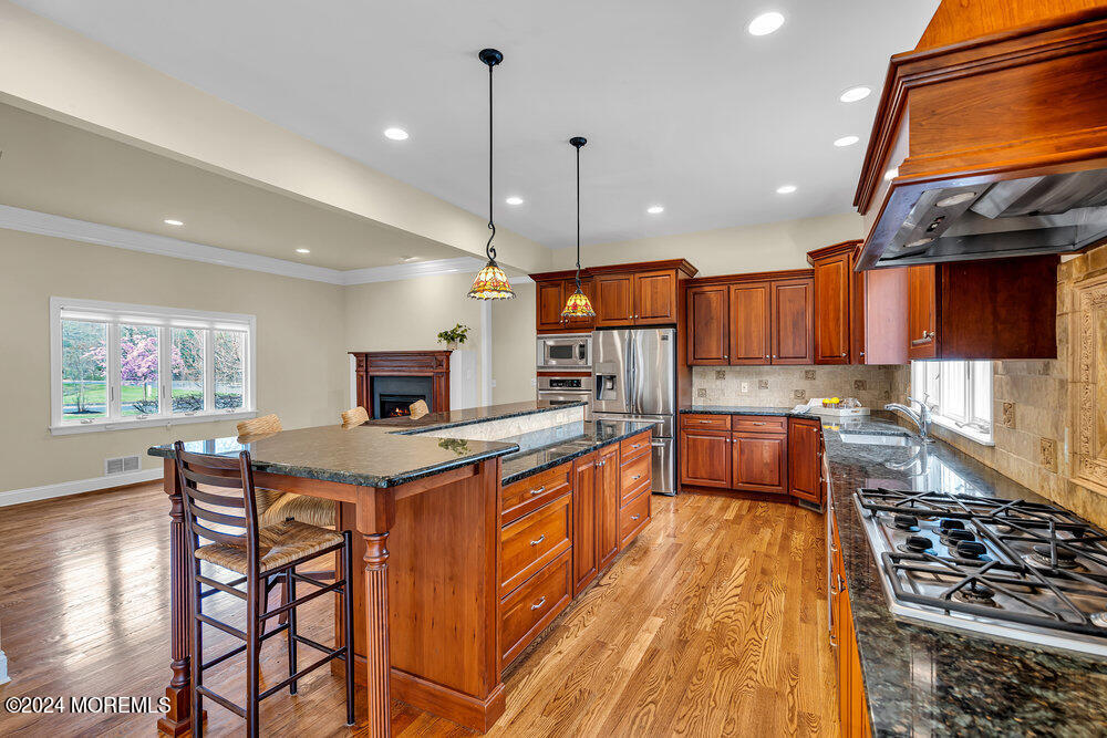 103 Obre Road Colts Neck, NJ 07722 - Photo 15 of 64 13_Kitchen_Fireplace2