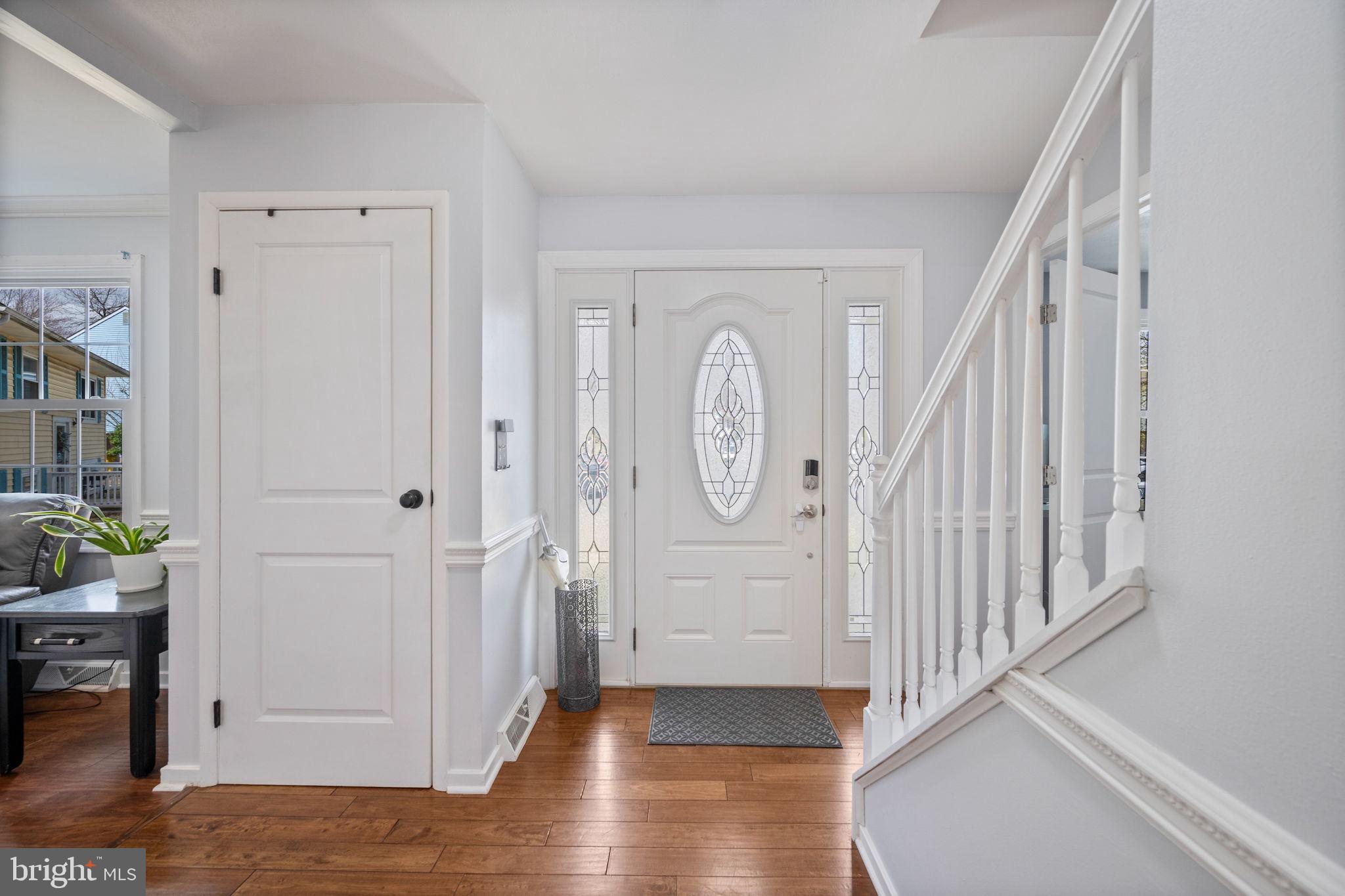 645 Ridgefield Court Glen Burnie, MD 21061 - Photo 17 of 62 a view of a hallway with wooden floor and entryway