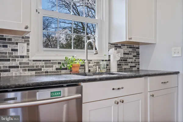 a kitchen with appliances and cabinets