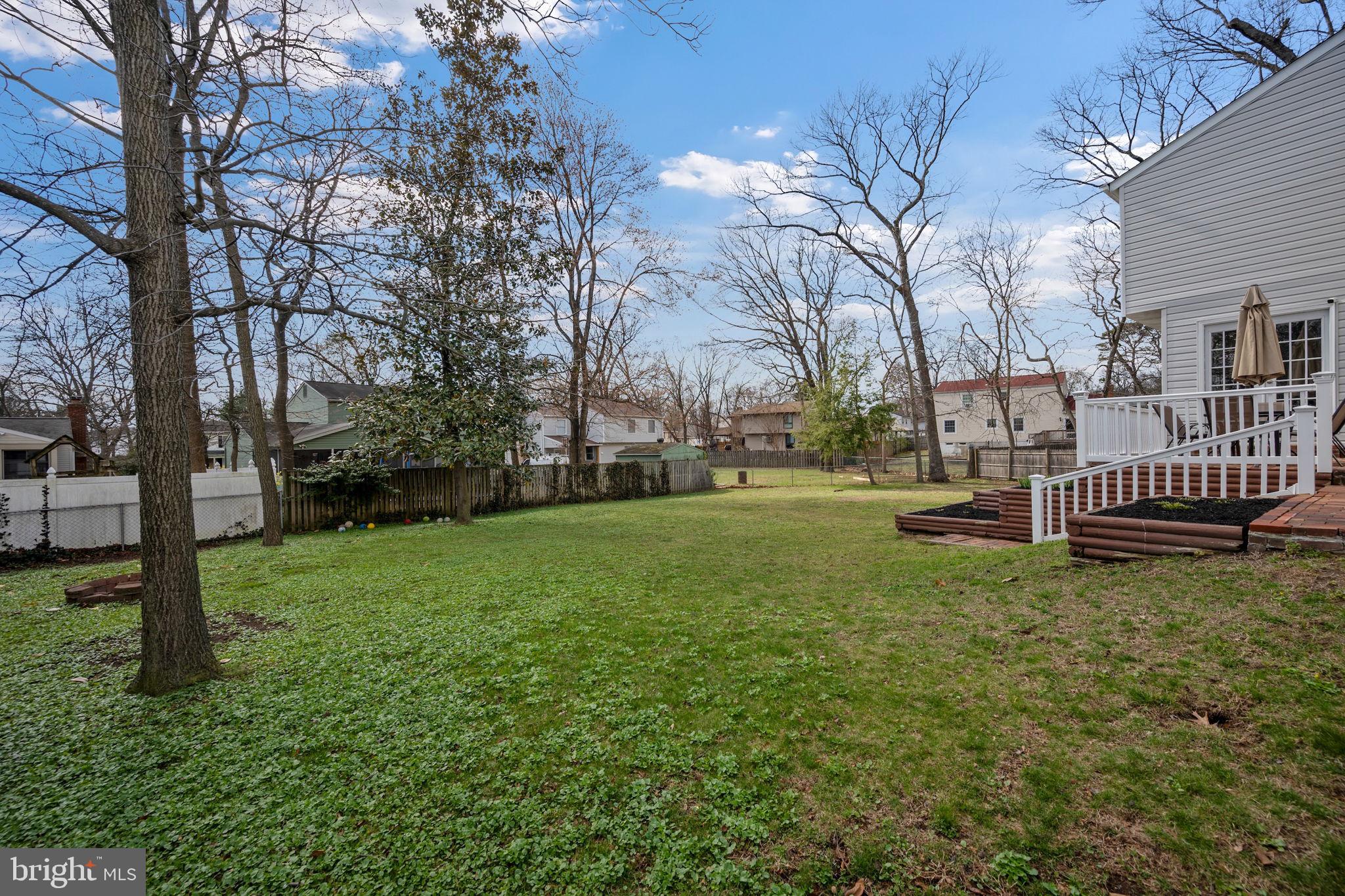 645 Ridgefield Court Glen Burnie, MD 21061 - Photo 39 of 62 a view of a house with backyard and a tree