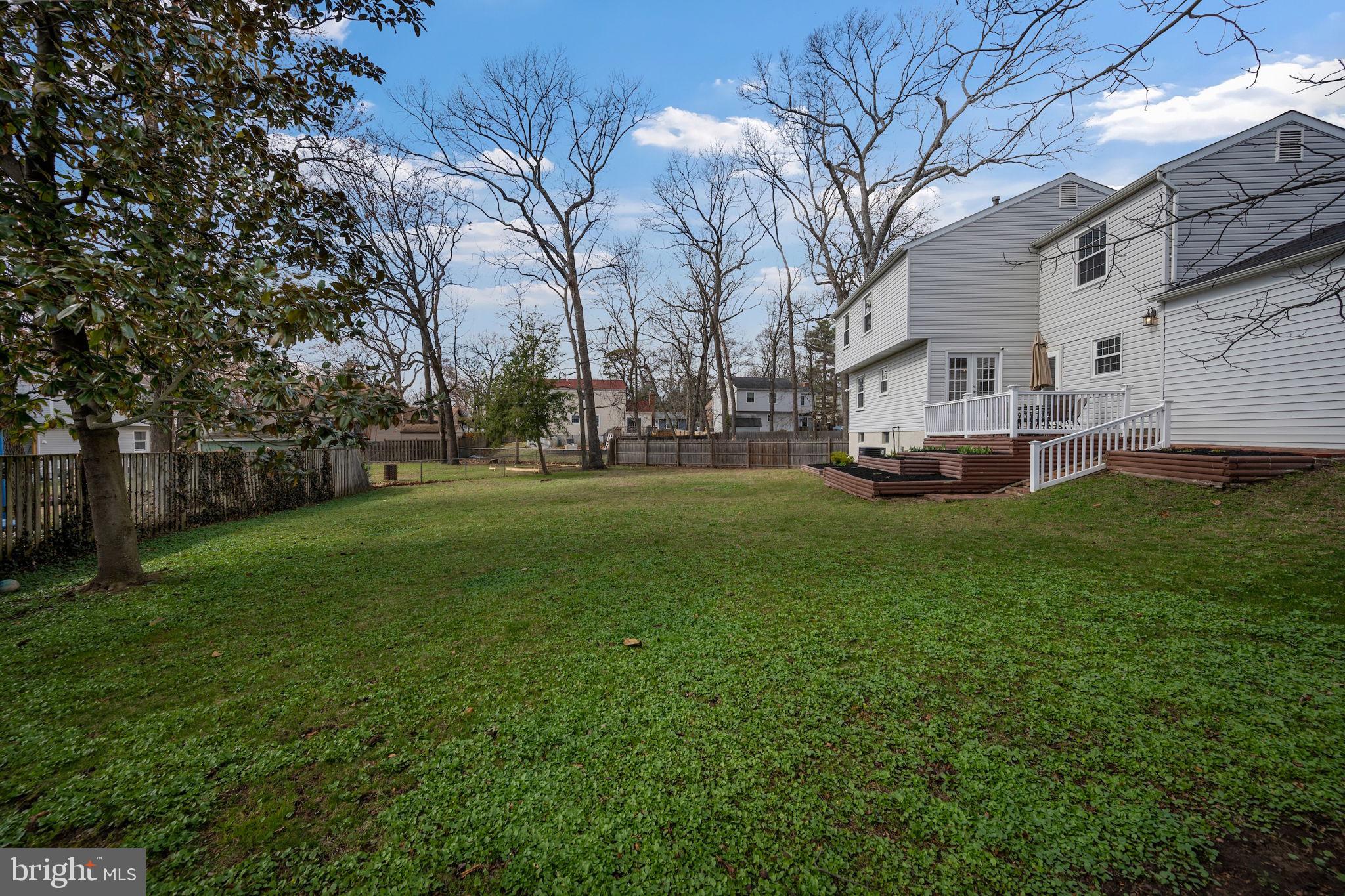 645 Ridgefield Court Glen Burnie, MD 21061 - Photo 41 of 62 a view of a house with a big yard with large trees