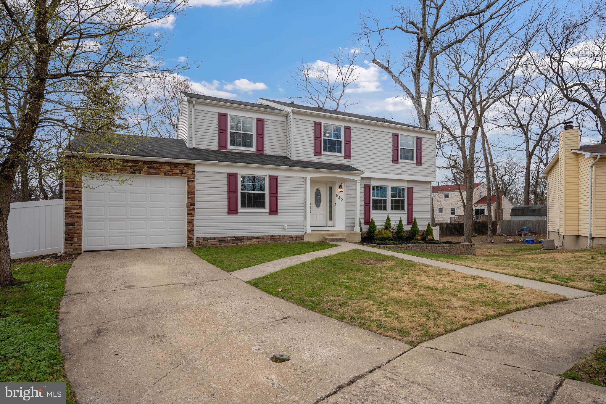 645 Ridgefield Court Glen Burnie, MD 21061 - Photo 42 of 62 a front view of a house with a yard