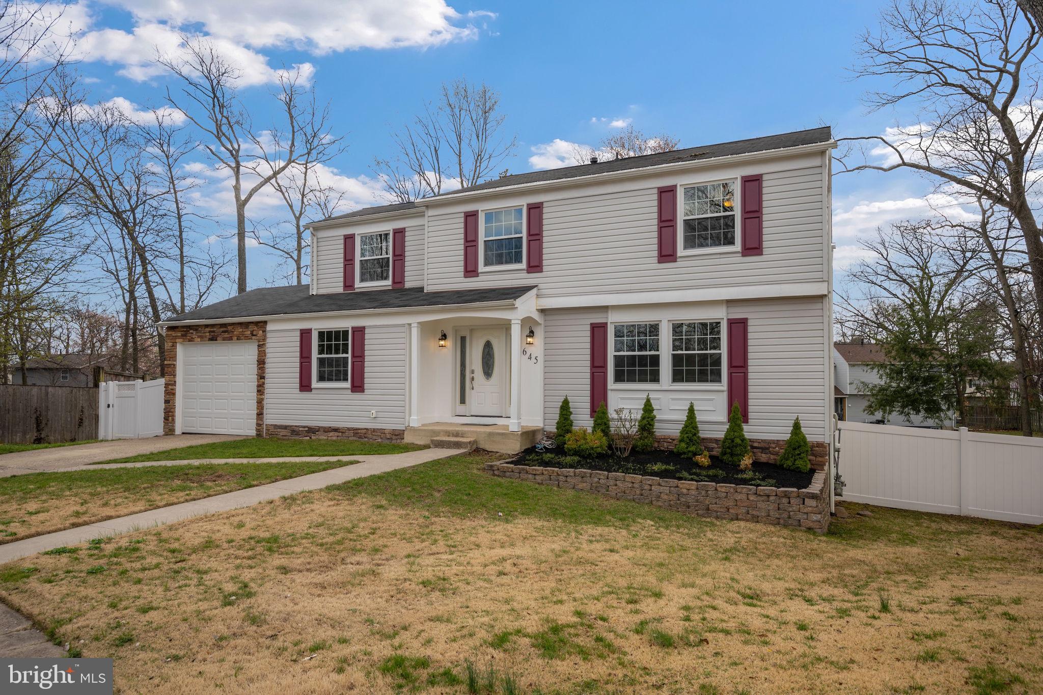 645 Ridgefield Court Glen Burnie, MD 21061 - Photo 43 of 62 a front view of a house with a yard