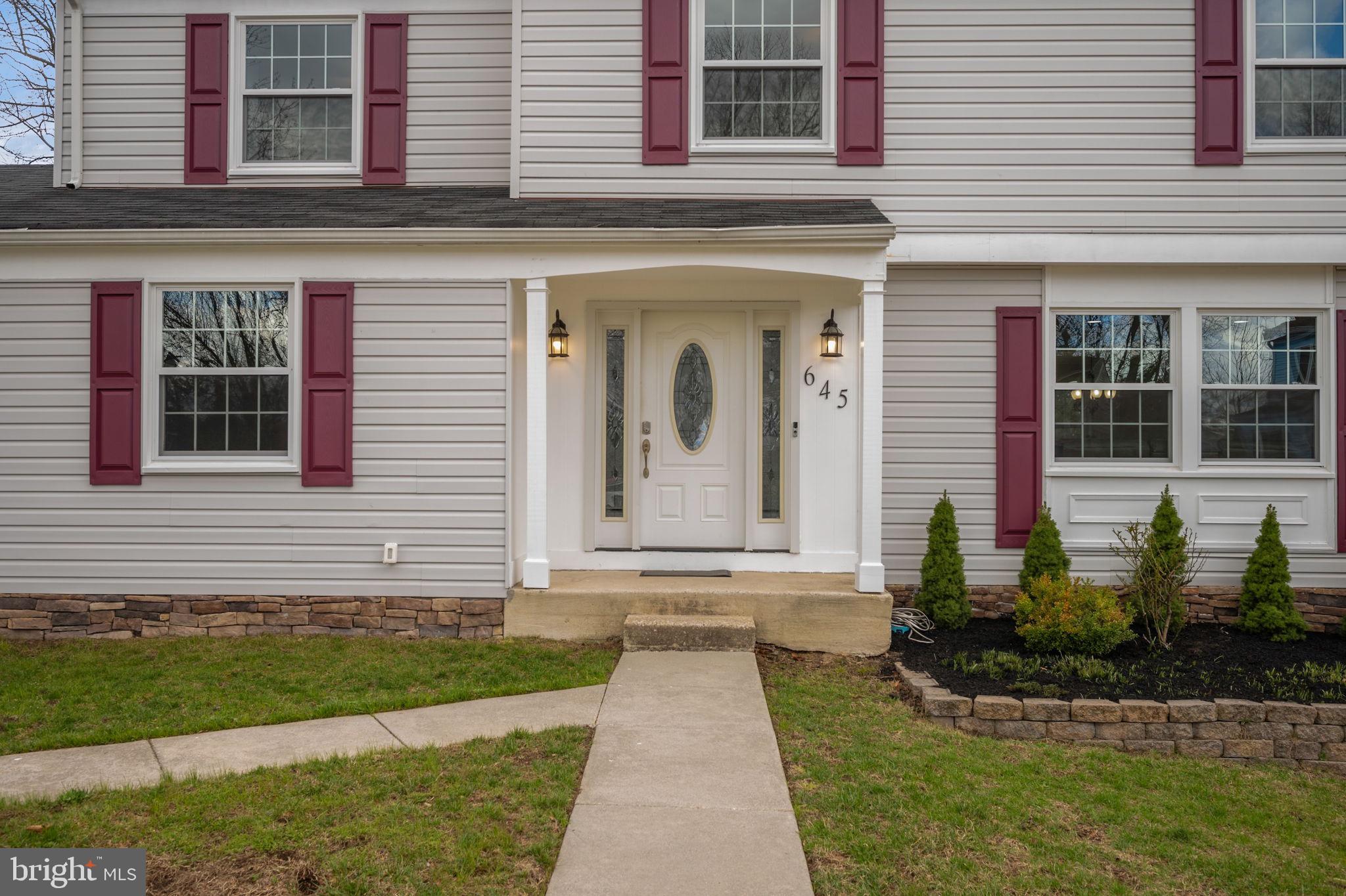 645 Ridgefield Court Glen Burnie, MD 21061 - Photo 45 of 62 a front view of a house with a yard
