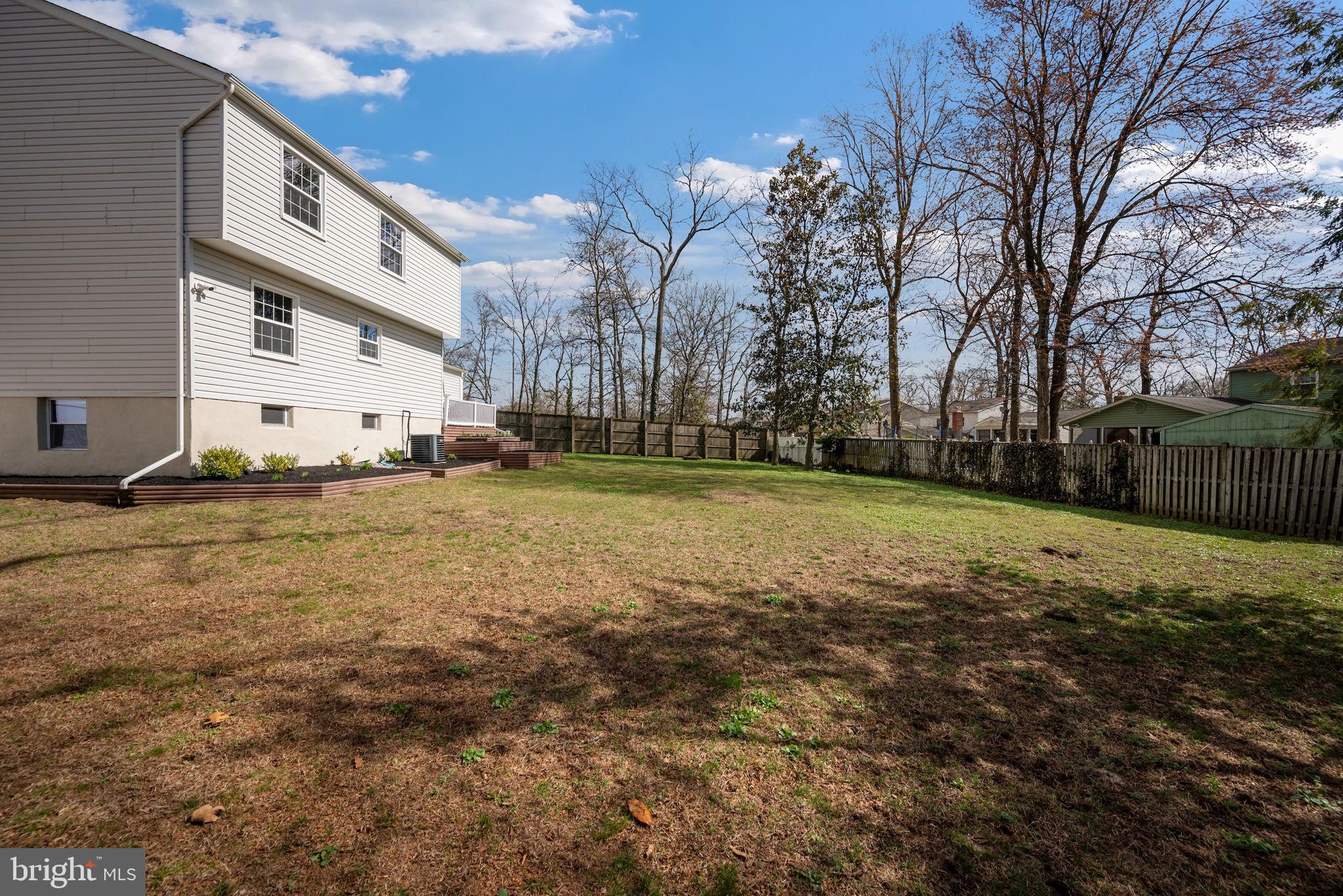 645 Ridgefield Court Glen Burnie, MD 21061 - Photo 48 of 62 a view of a yard with a house