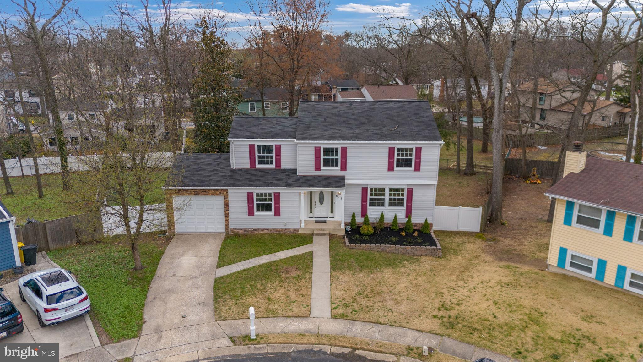 645 Ridgefield Court Glen Burnie, MD 21061 - Photo 56 of 62 front view of a house with a yard