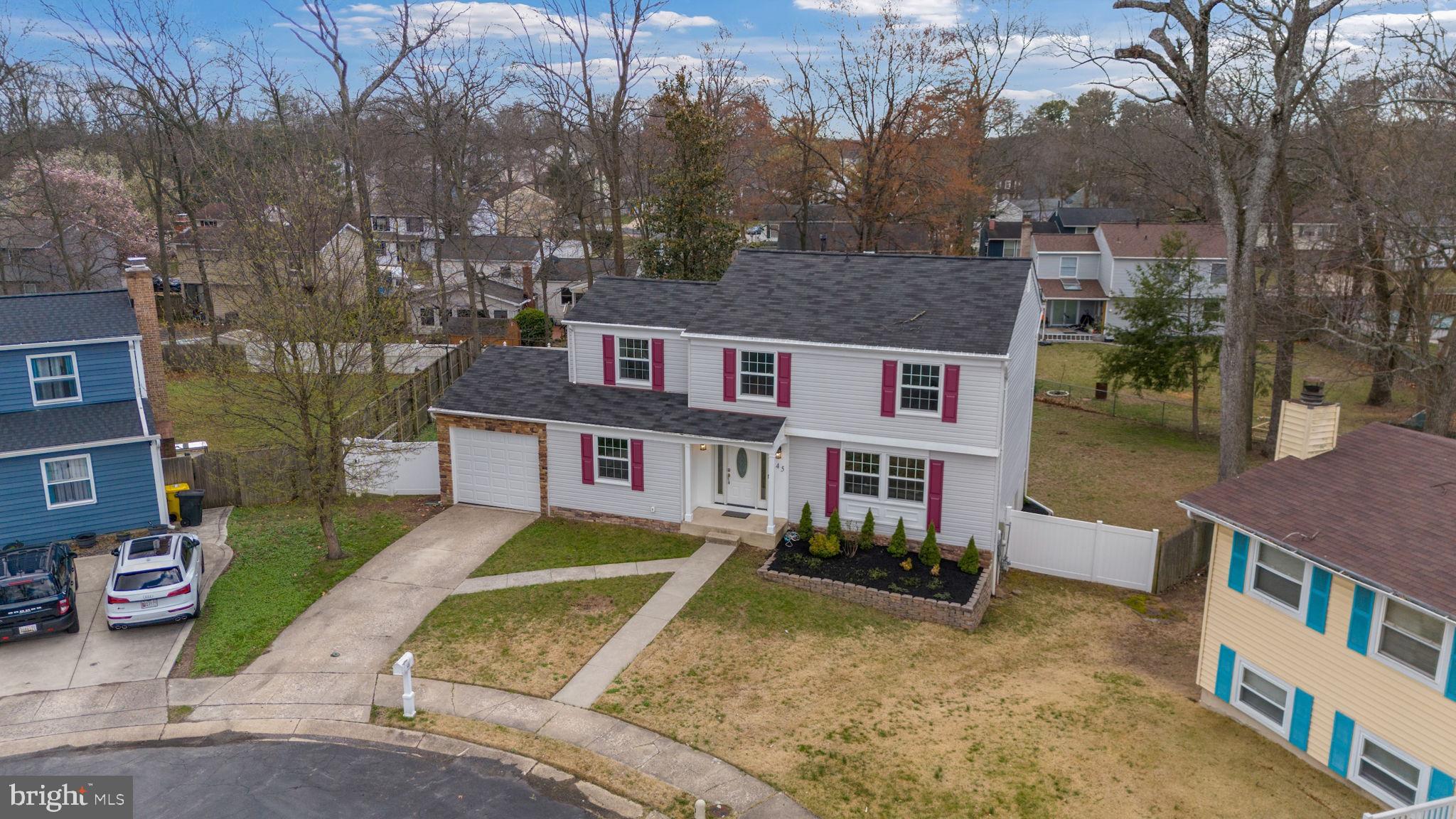 645 Ridgefield Court Glen Burnie, MD 21061 - Photo 57 of 62 a aerial view of a house with a yard and large trees