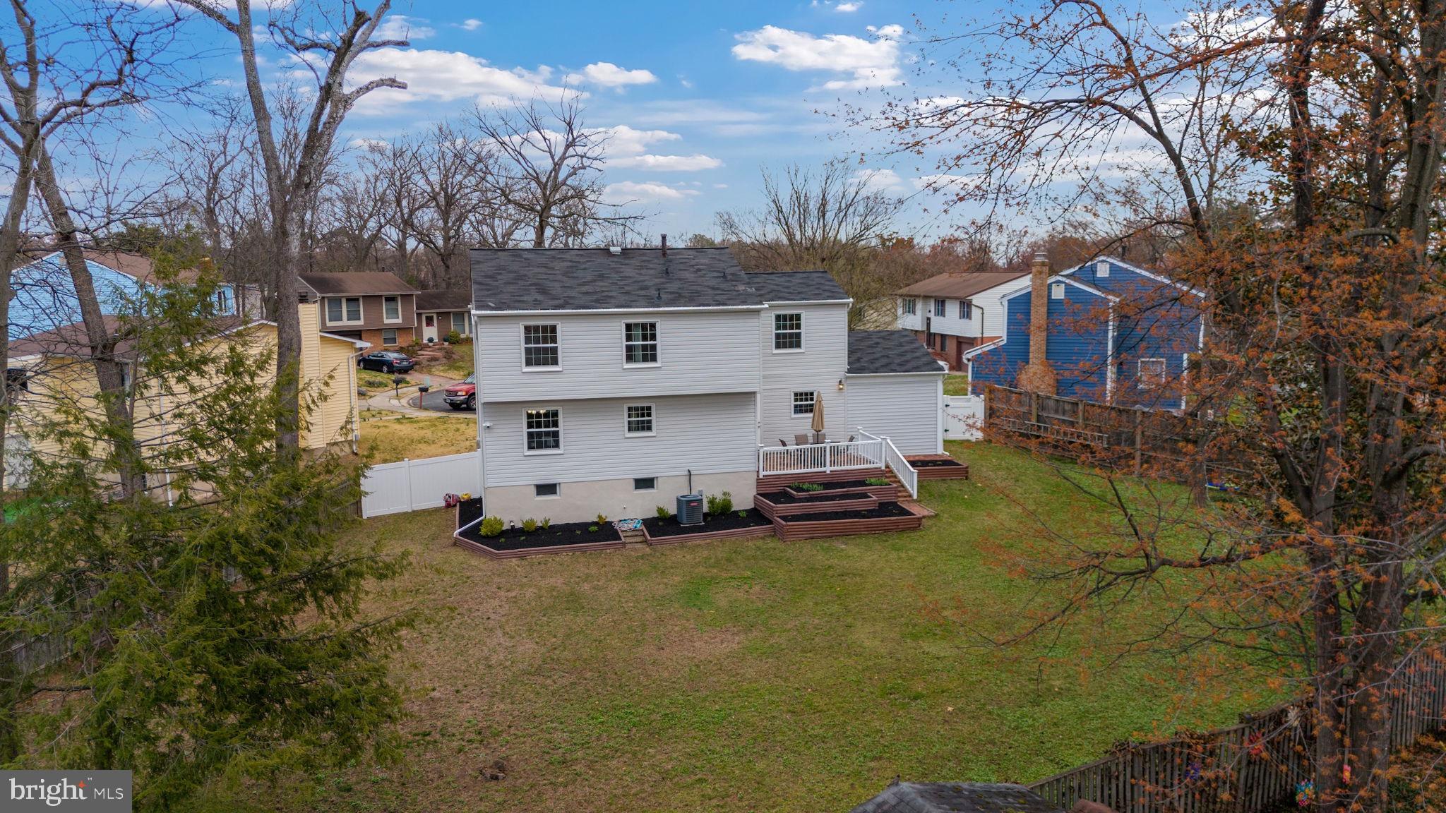 645 Ridgefield Court Glen Burnie, MD 21061 - Photo 58 of 62 a white house that has a tree in front of it