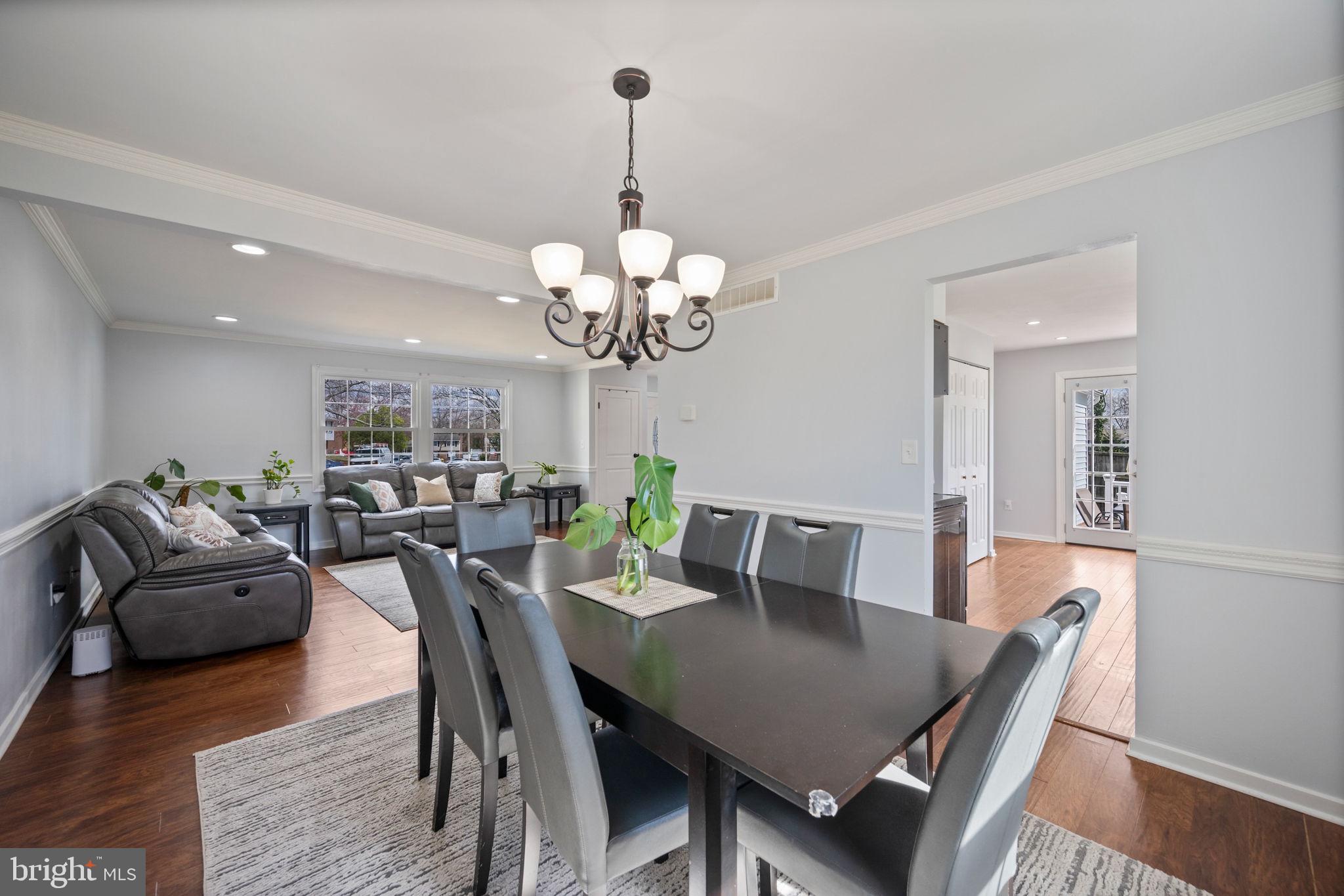 645 Ridgefield Court Glen Burnie, MD 21061 - Photo 10 of 62 a view of a dining room with furniture and wooden floor
