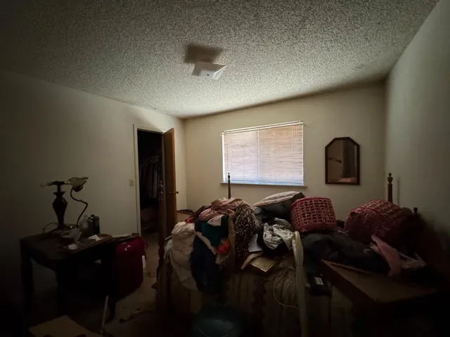 a bed room with furniture and a window