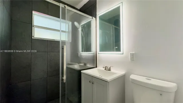 a bathroom with a sink and mirror