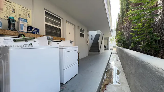 a view of storage and utility room with washer and dryer