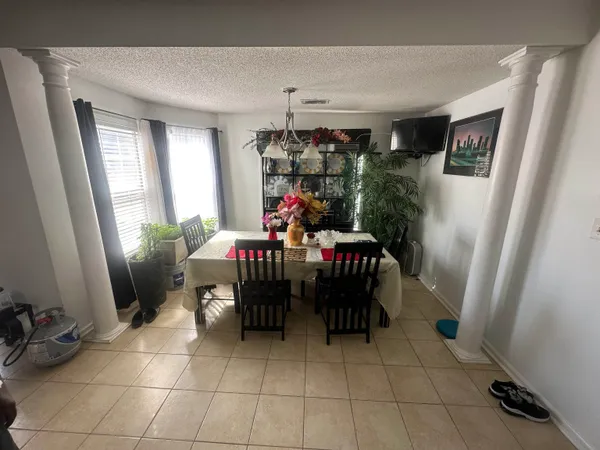 a utility room with dryer washer and a window