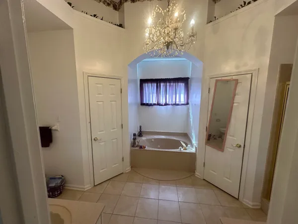 a bathroom with a sink toilet tub and shower