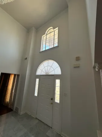 an empty room that has a window in it