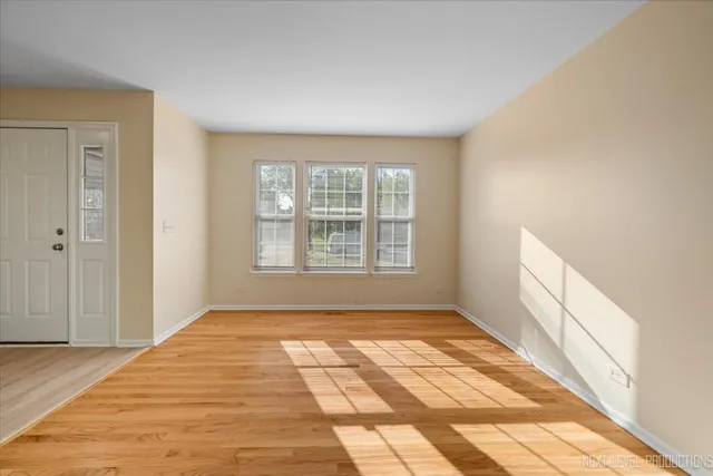 a view of an empty room and window