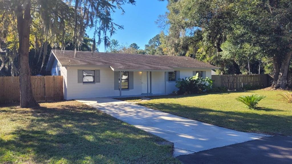 7642 Southwest 80th Street Ocala, FL 34476 - Photo 1 of 1 a view of a house with a yard