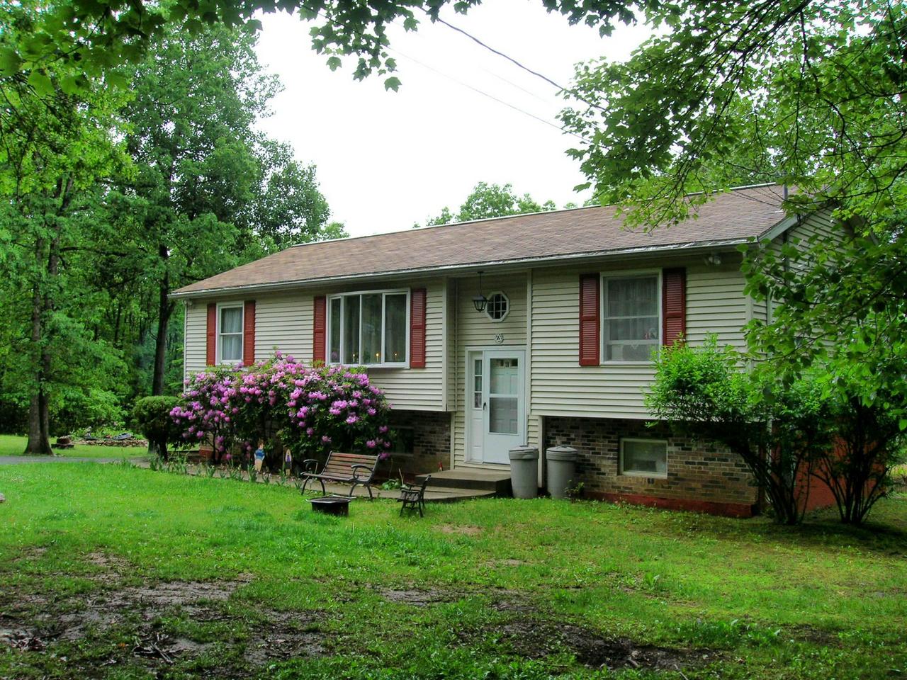 a front view of house with an garden and entertaining space