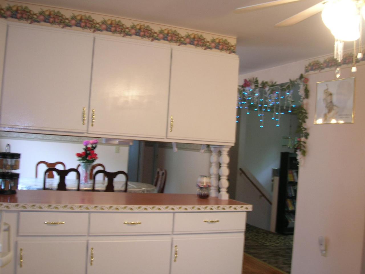 1612 Maple Road Effort, PA 18330 - Photo 4 of 7 a kitchen with granite countertop a white cabinets and a stove