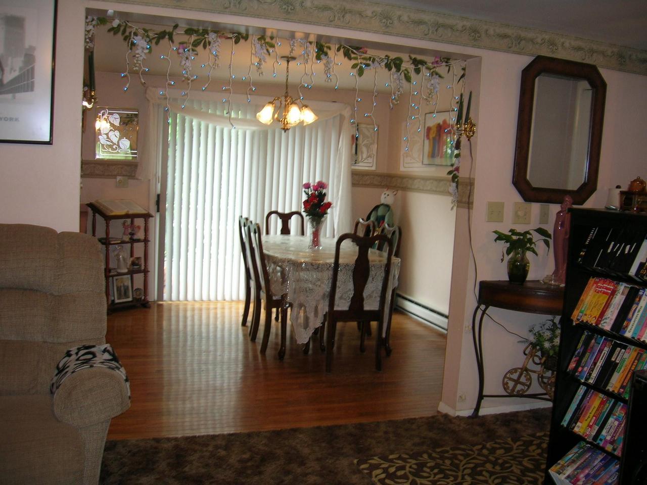 1612 Maple Road Effort, PA 18330 - Photo 6 of 7 a view of a dining room with furniture and a chandelier