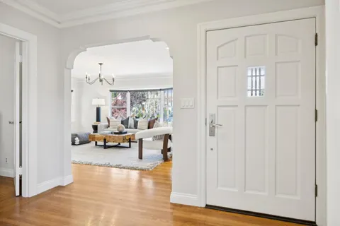 a living room with furniture and a table