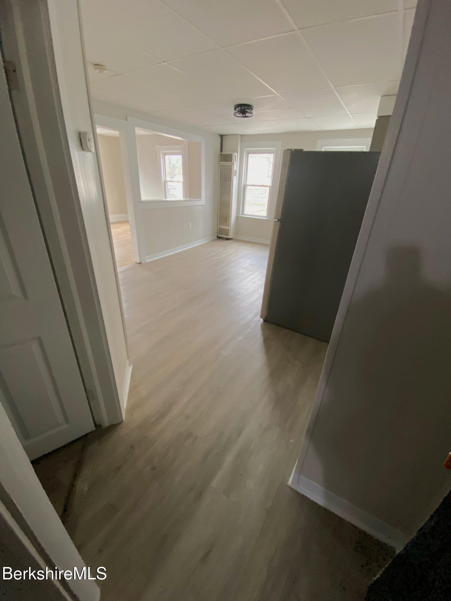 a view of hallway with window and stairs