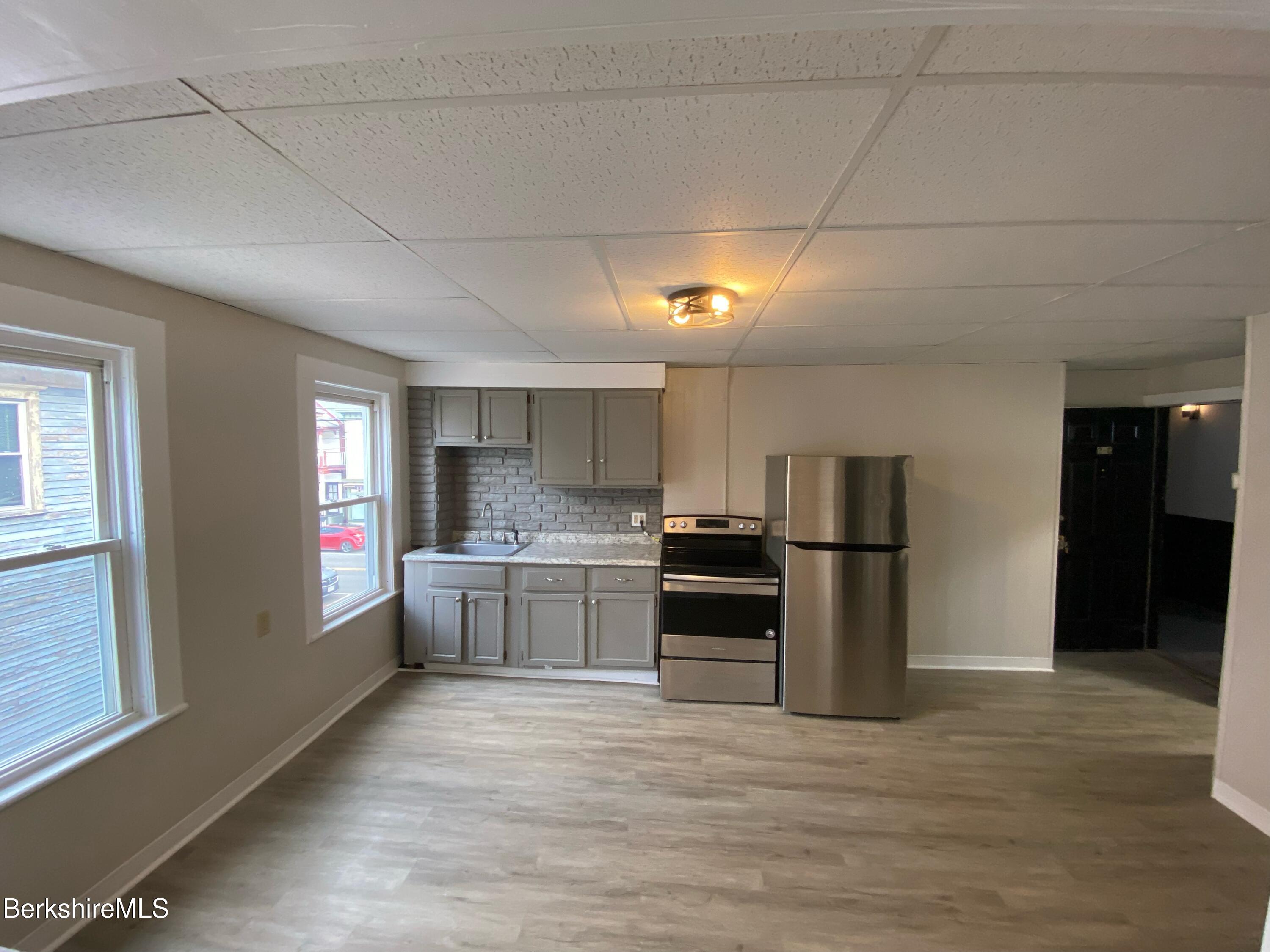 88 Summer Street, Unit 2C Adams, MA 01220 - Photo 7 of 10 a kitchen with refrigerator and window