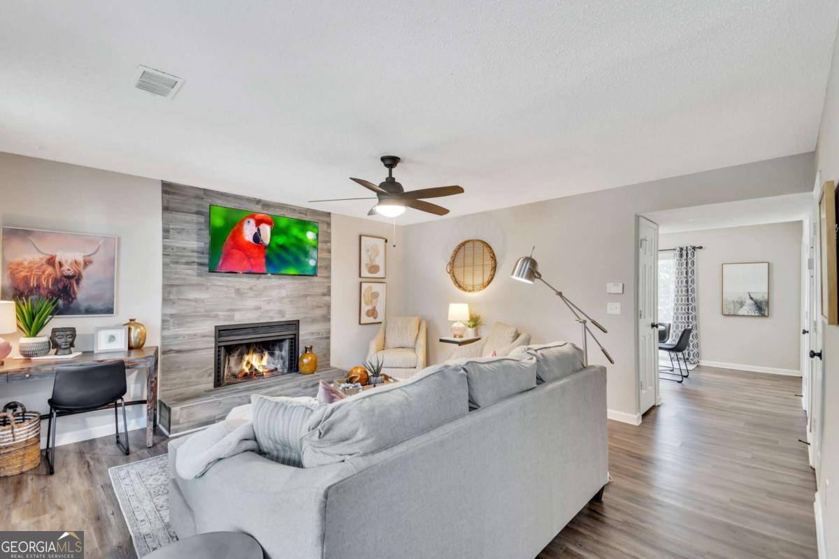 a living room with furniture and a fireplace