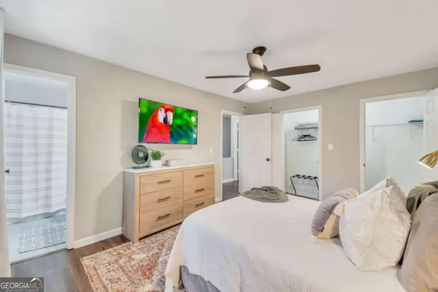 a bedroom with a bed and a dresser