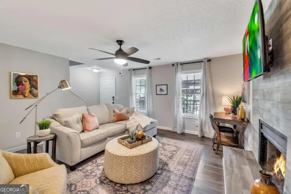 a living room with furniture and a flat screen tv