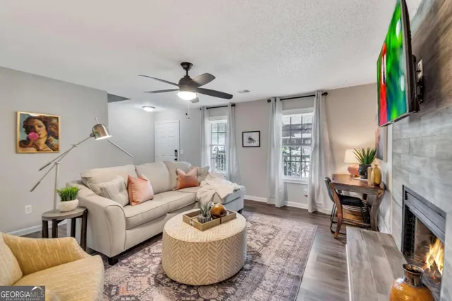 a living room with furniture and a flat screen tv