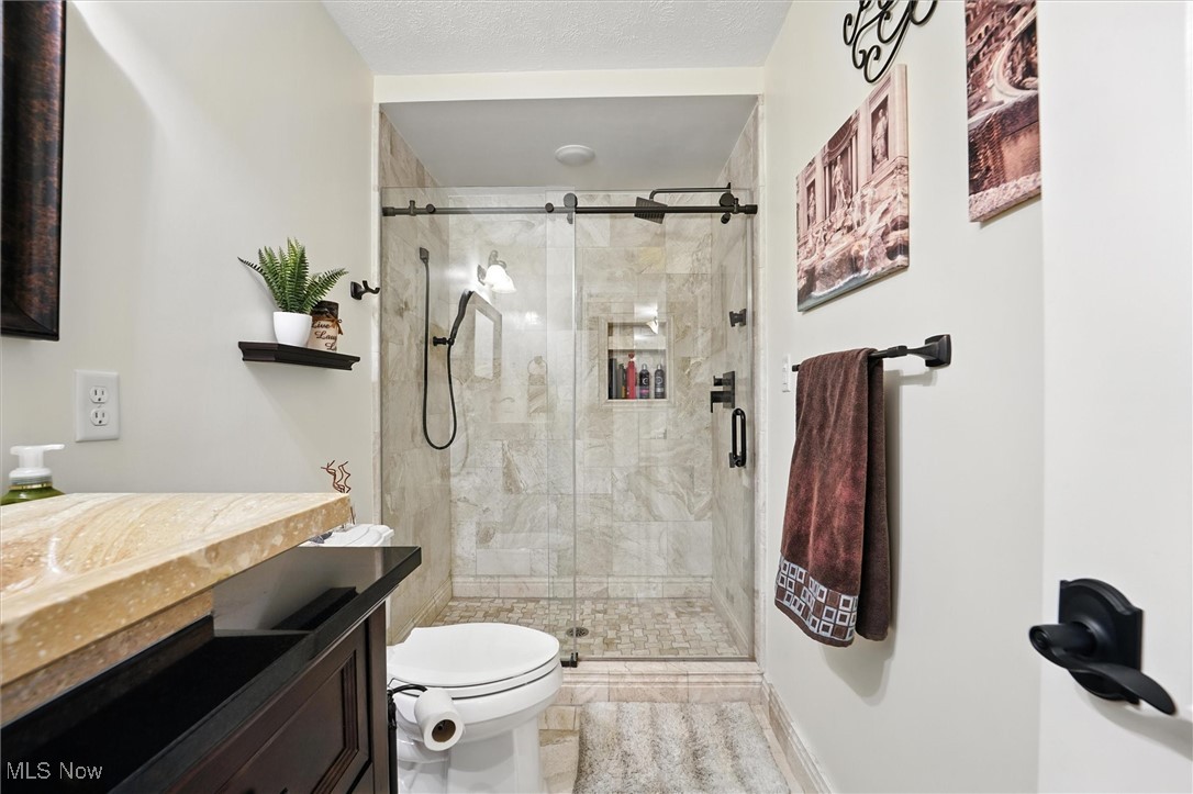 2930 South Ridge Road East Kingsville, OH 44048 - Photo 19 of 49 Full hall bathroom featuring vanity, a stall shower, marble floor