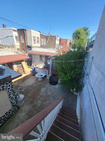 a view of swimming pool with seating area