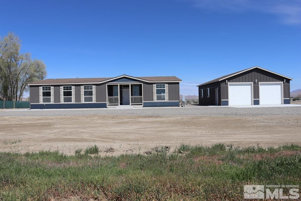 7275 West Rose Creek Road Winnemucca, NV 89445 - Photo 1 of 25 a house view with a garden space