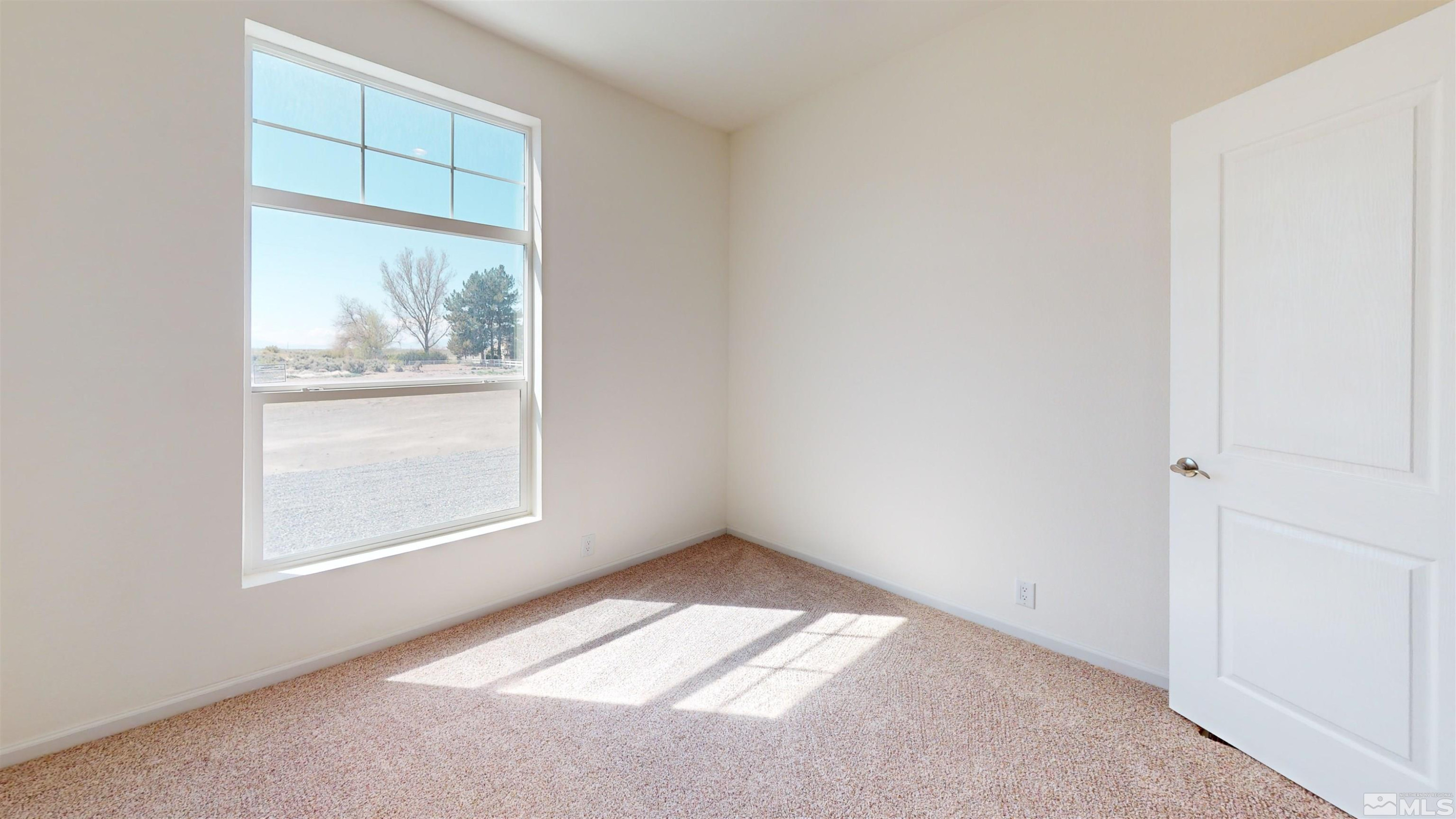 7275 West Rose Creek Road Winnemucca, NV 89445 - Photo 11 of 25 an empty room with a window