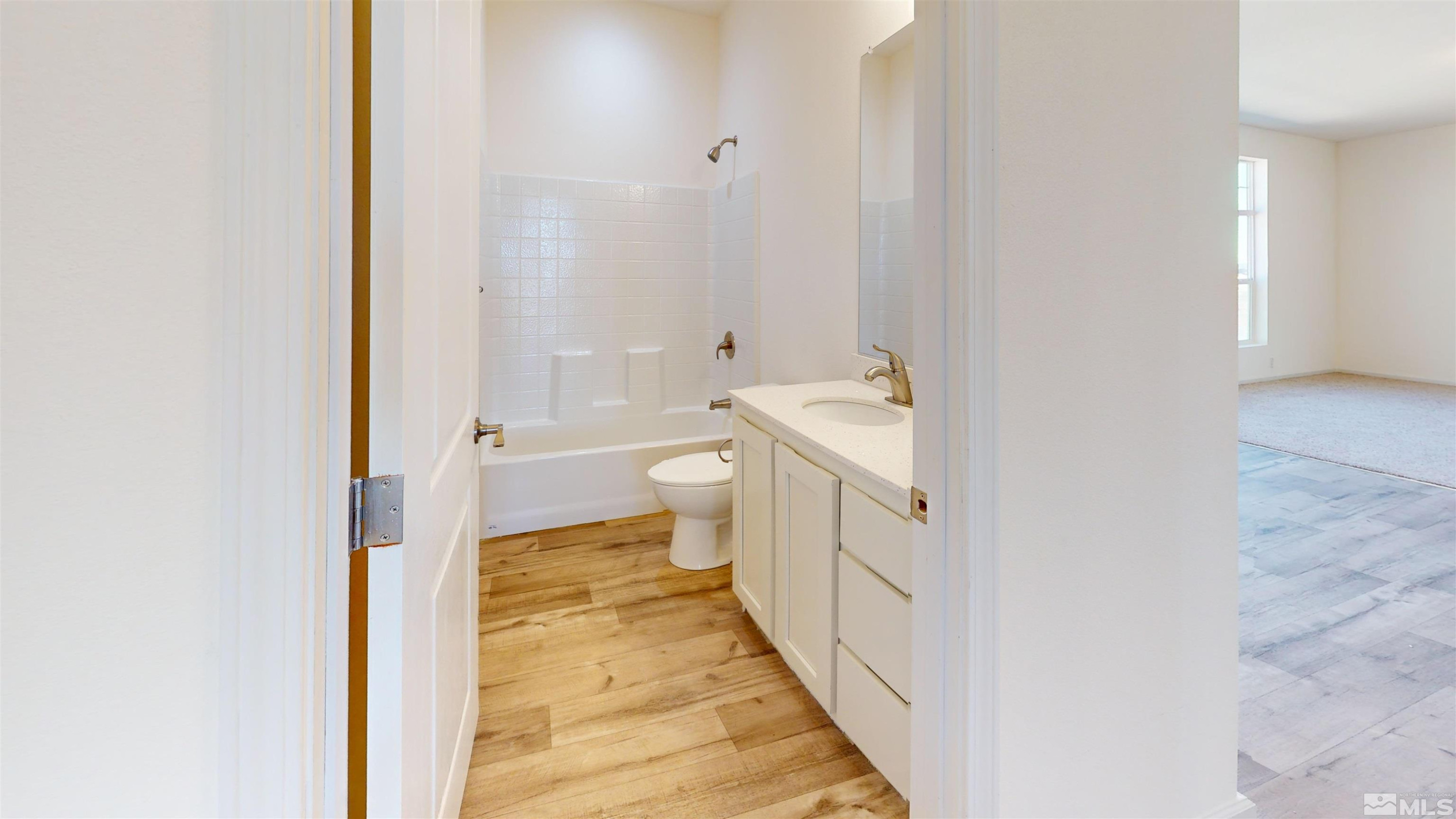 7275 West Rose Creek Road Winnemucca, NV 89445 - Photo 12 of 25 a bathroom with a sink a toilet and shower