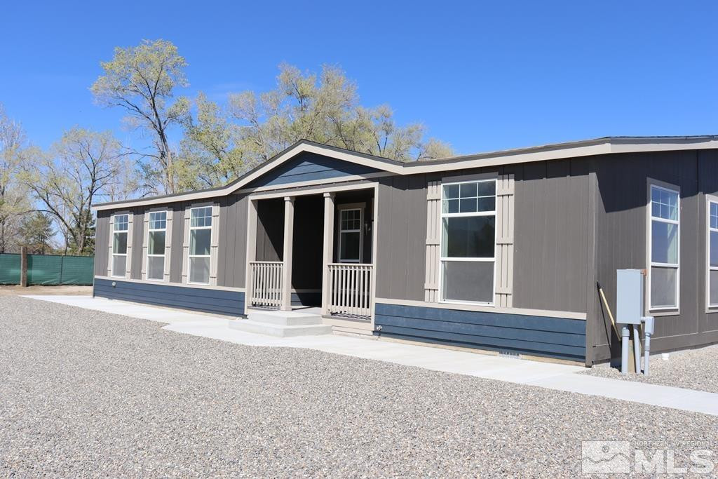 7275 West Rose Creek Road Winnemucca, NV 89445 - Photo 18 of 25 front view of a house with a porch