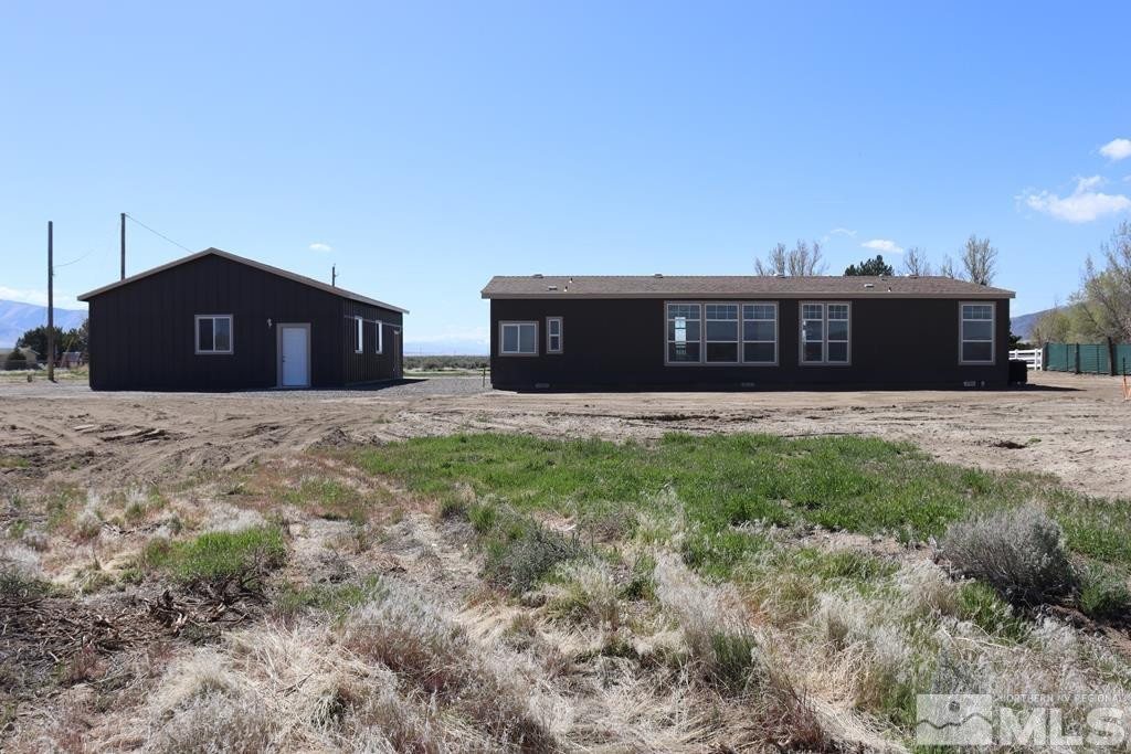 7275 West Rose Creek Road Winnemucca, NV 89445 - Photo 20 of 25 a view of a house with a yard
