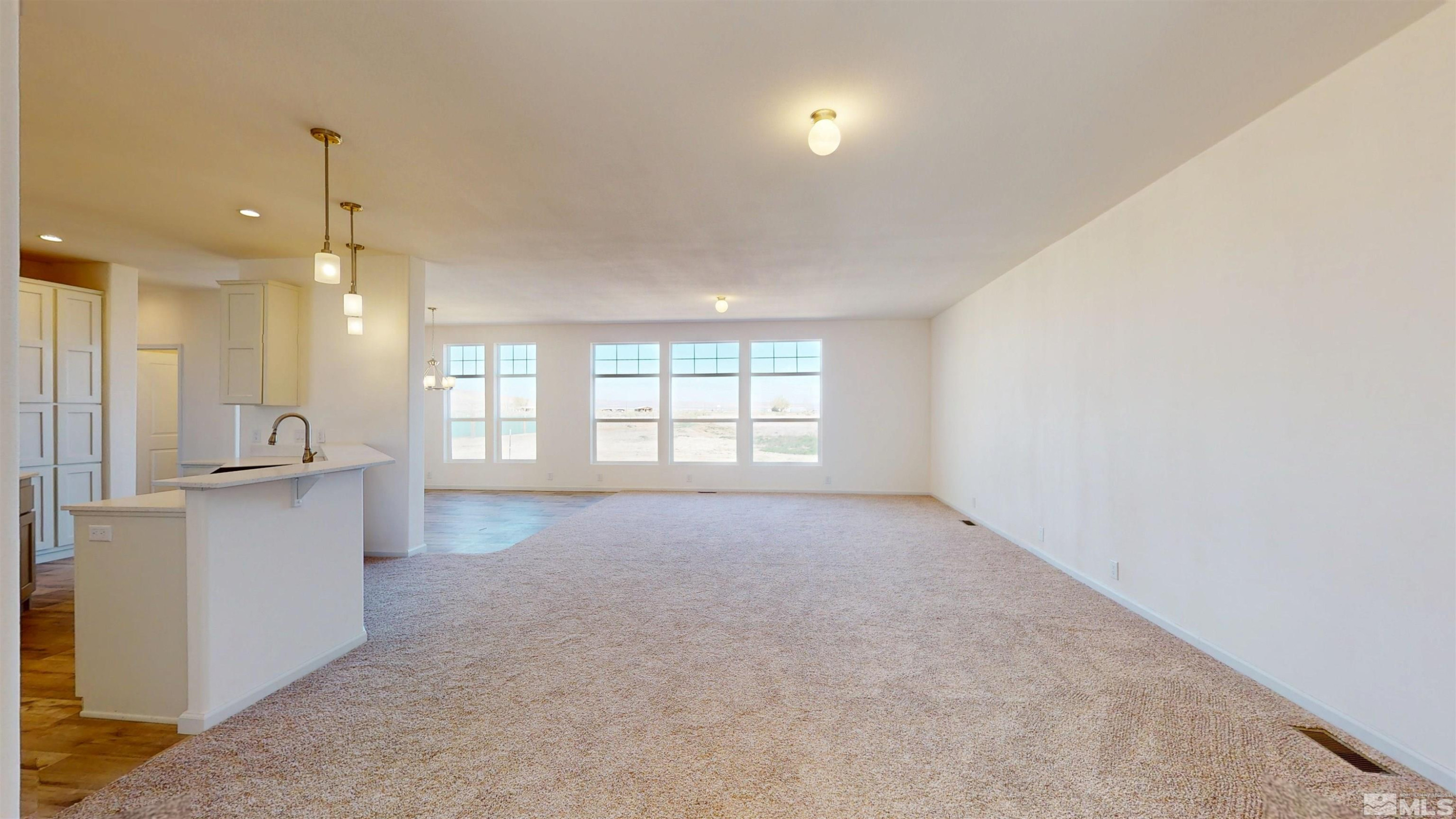 7275 West Rose Creek Road Winnemucca, NV 89445 - Photo 3 of 25 a view of an empty room with a kitchen