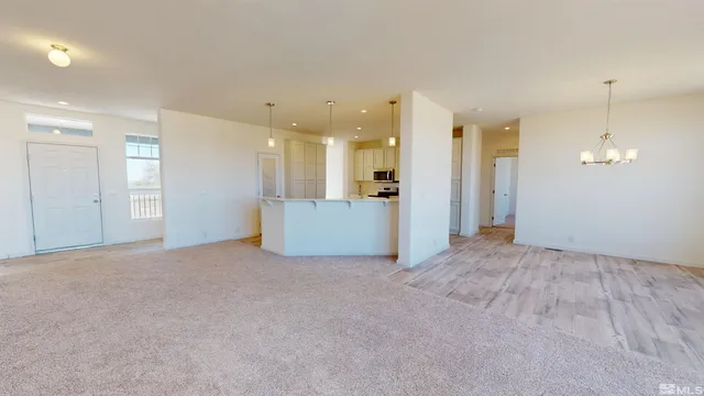 a view of a livingroom with a kitchen
