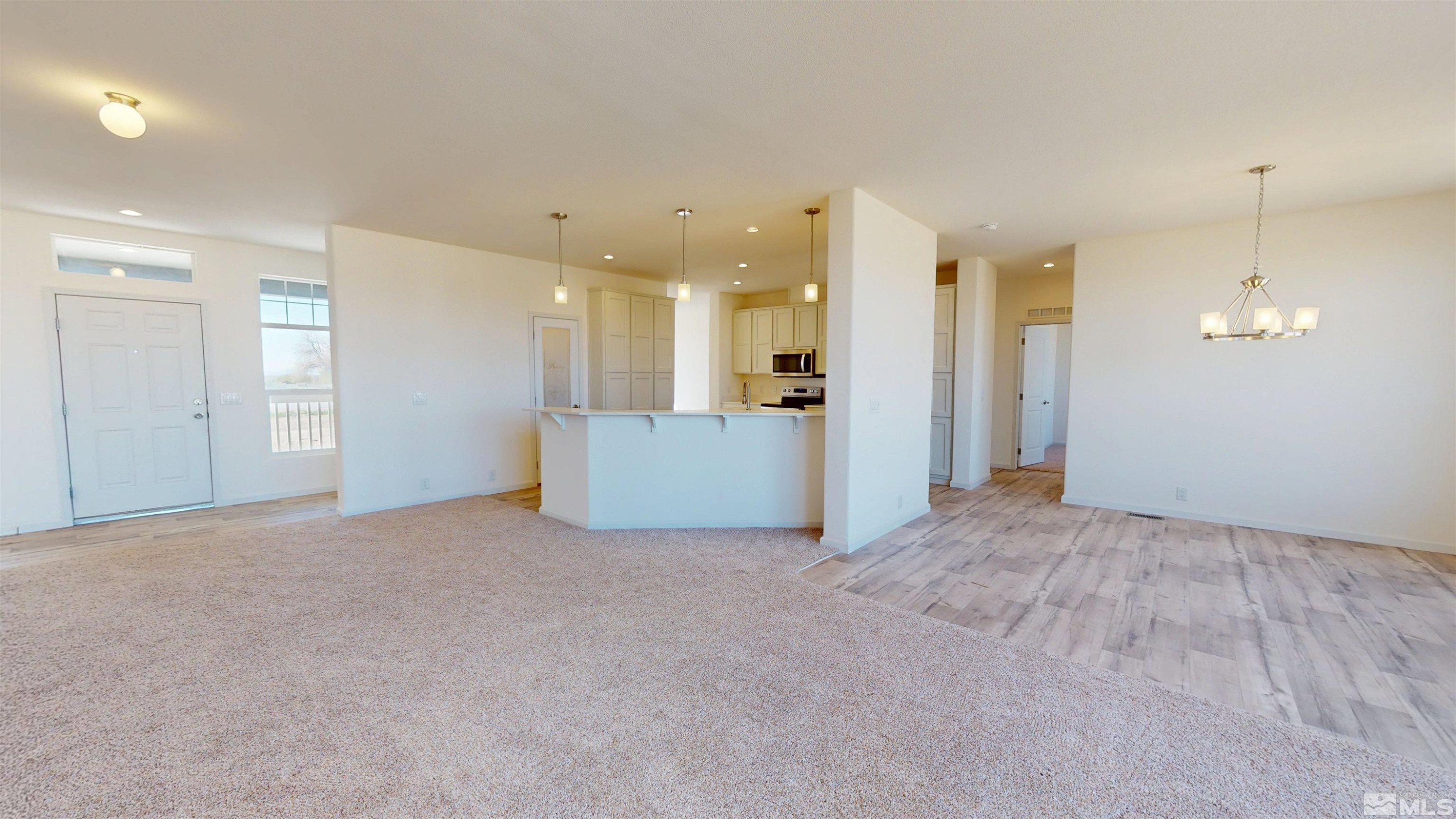7275 West Rose Creek Road Winnemucca, NV 89445 - Photo 4 of 25 a view of a livingroom with a kitchen