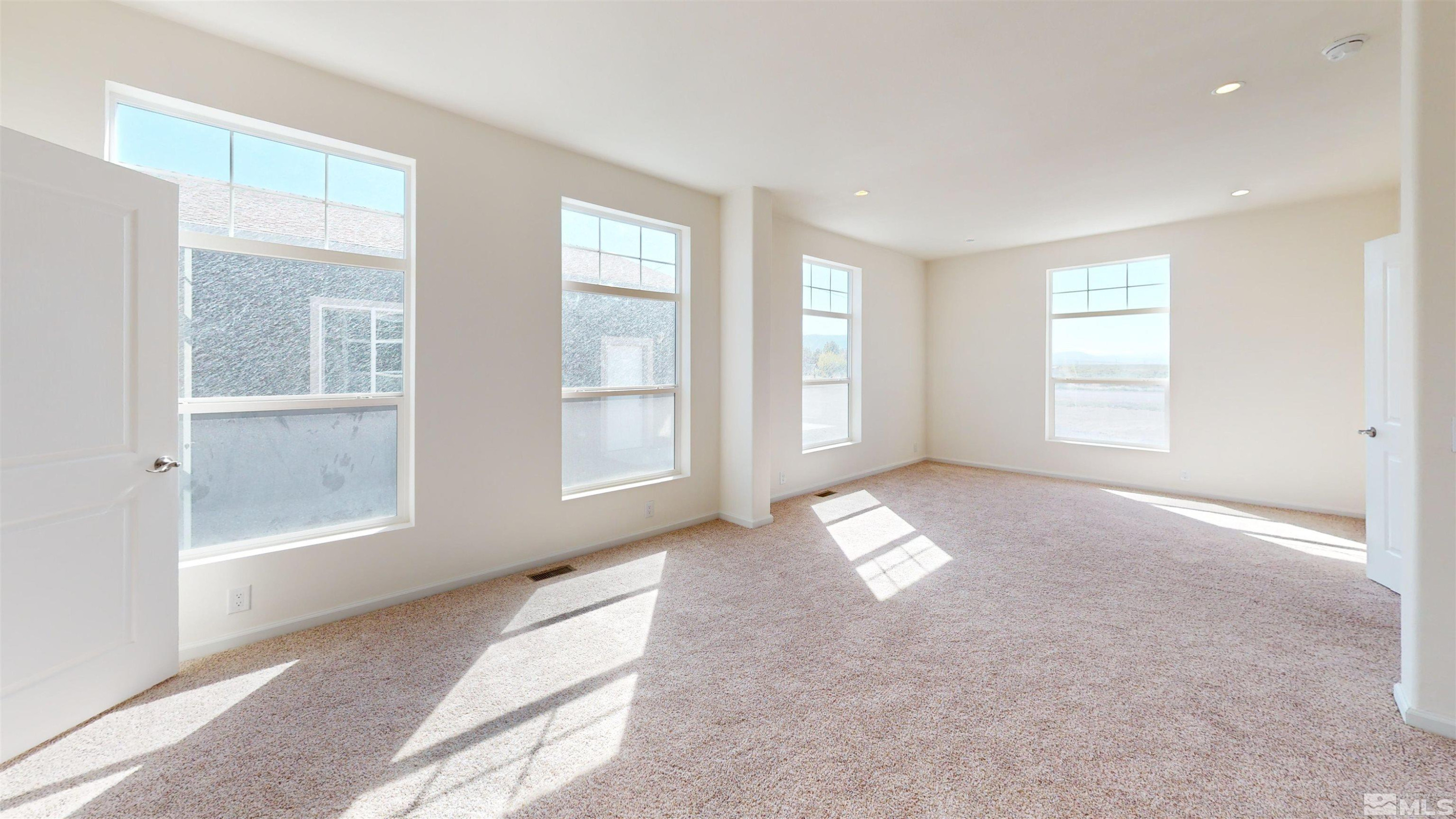 7275 West Rose Creek Road Winnemucca, NV 89445 - Photo 7 of 25 an empty room with windows
