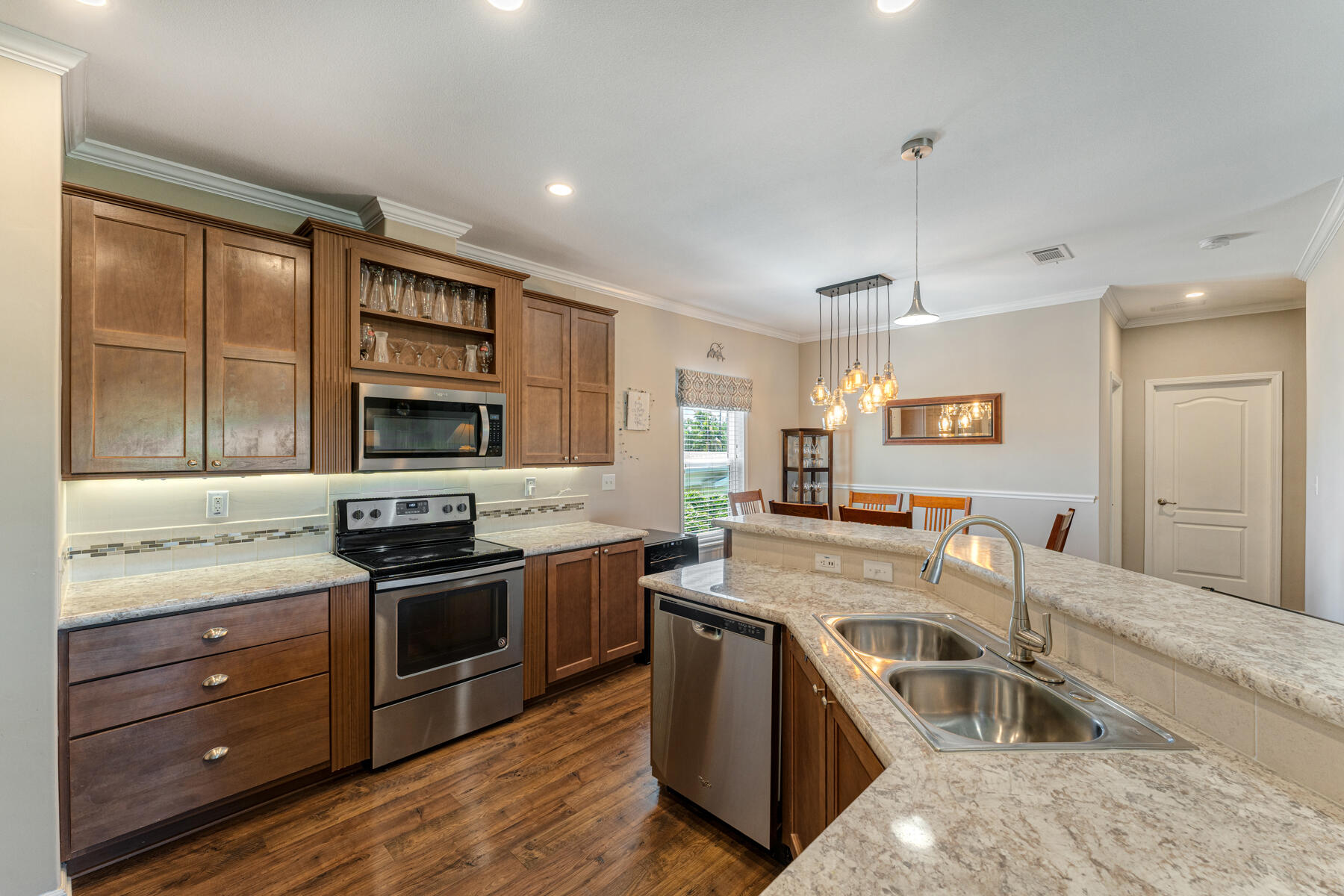 650 64th Street Marathon, FL 33050 - Photo 12 of 45 a kitchen with stainless steel appliances granite countertop a stove and a sink