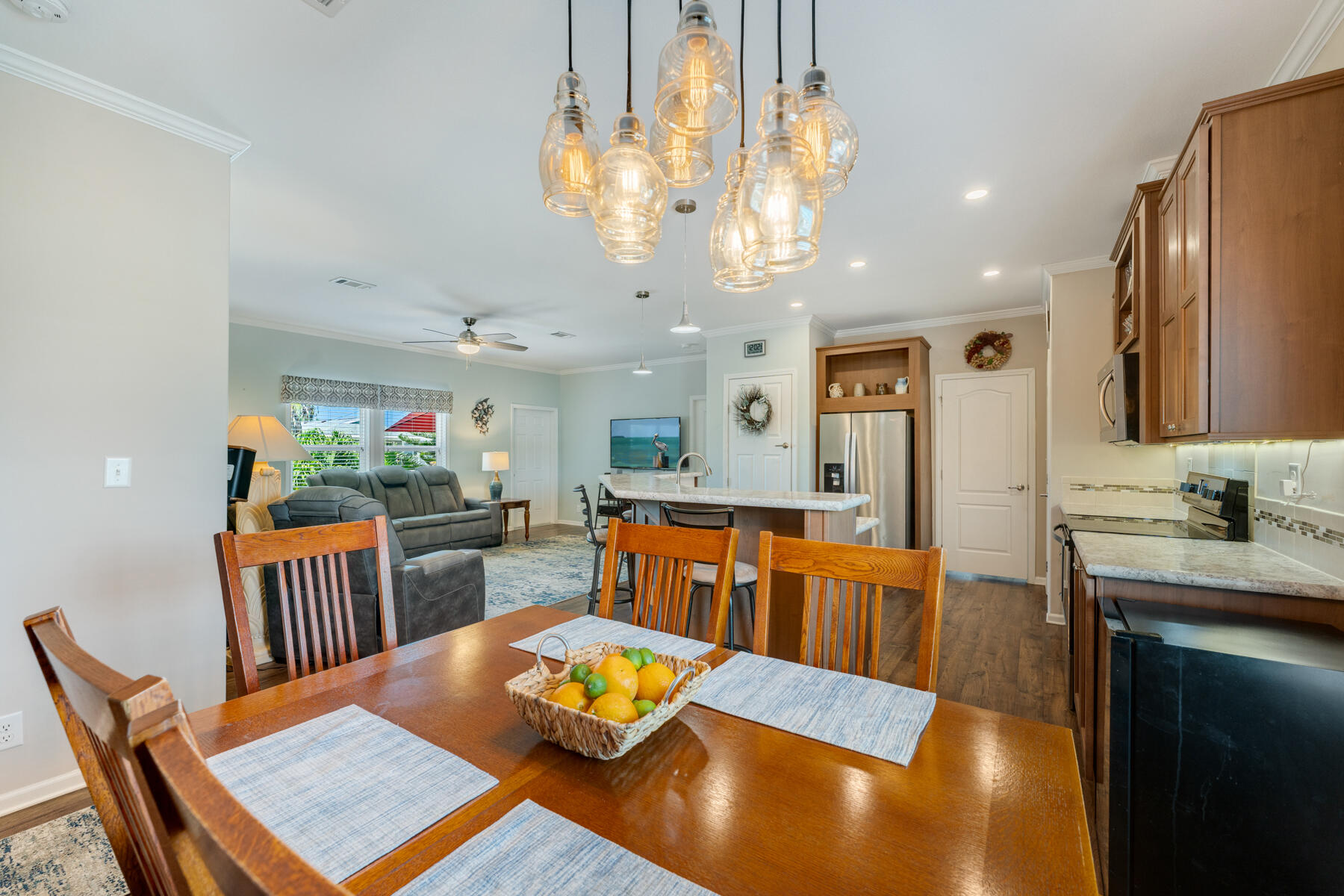 650 64th Street Marathon, FL 33050 - Photo 16 of 45 a living room with kitchen island furniture and a chandelier