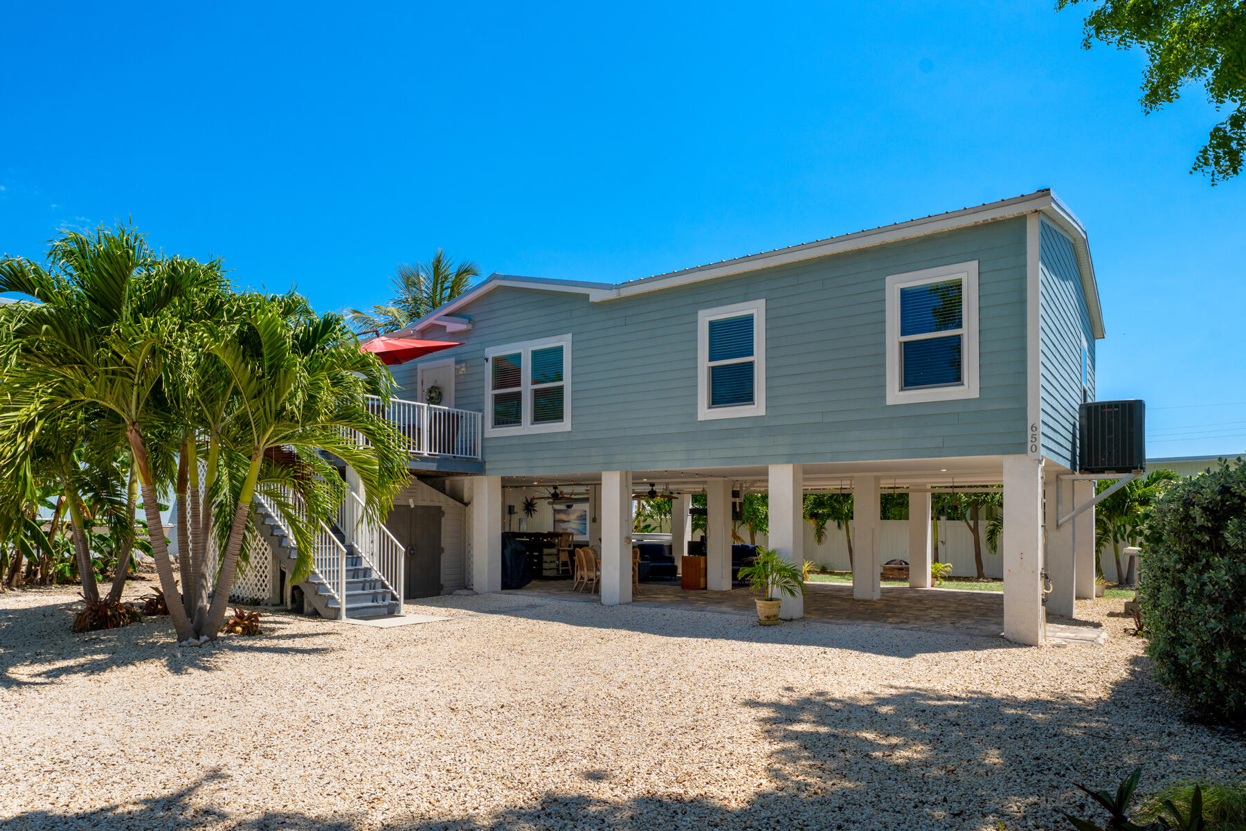650 64th Street Marathon, FL 33050 - Photo 5 of 45 a front view of a house with a yard