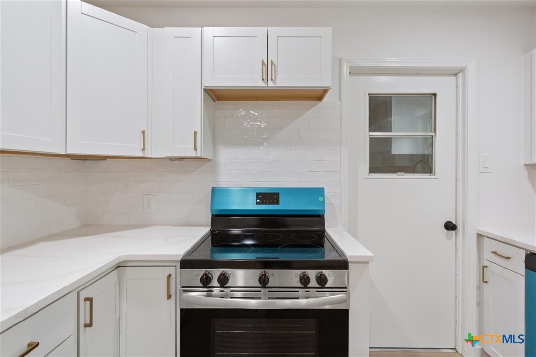 4412 Briar Cliff Road Temple, TX 76502 - Photo 14 of 35 a stove top oven sitting inside of a kitchen