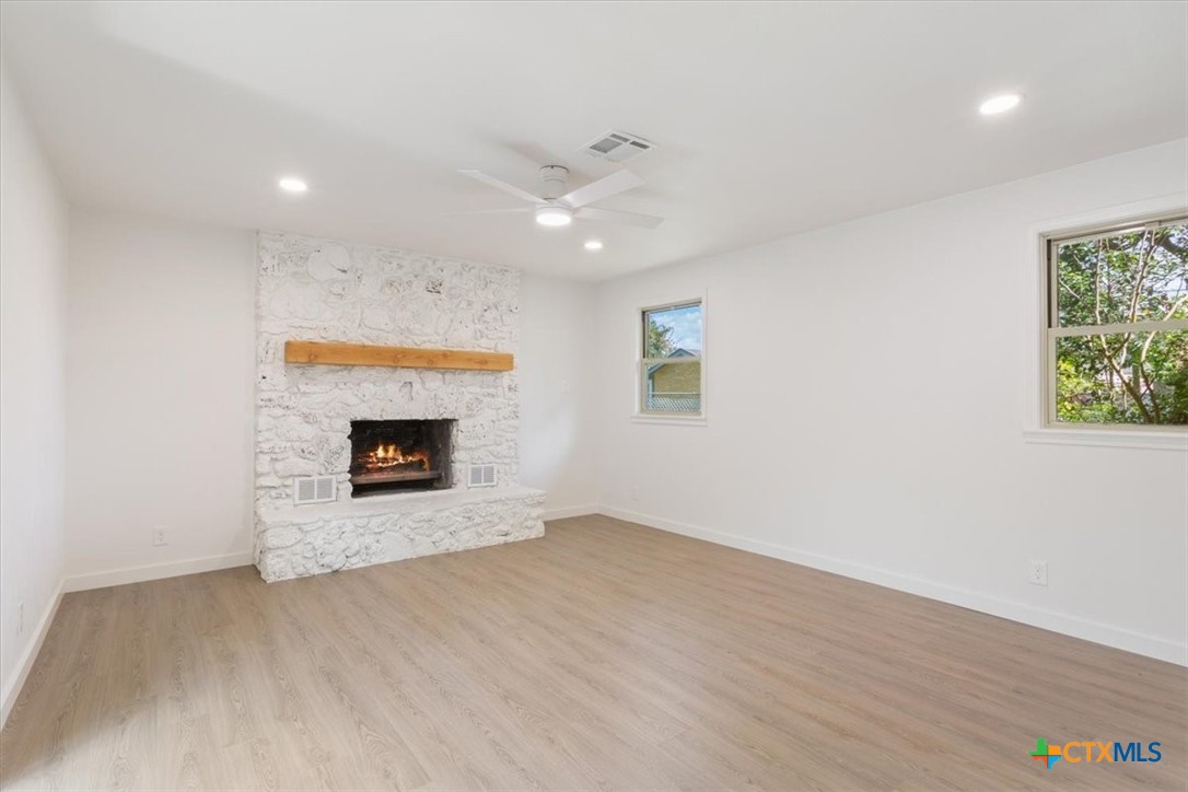 4412 Briar Cliff Road Temple, TX 76502 - Photo 20 of 35 an empty room with windows and fireplace